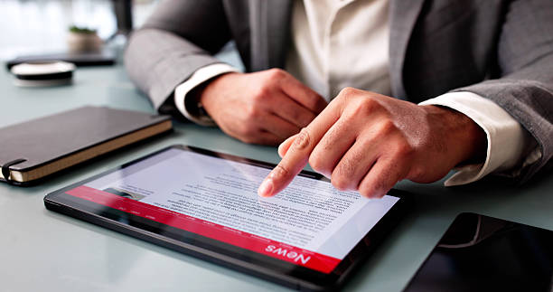 istock African American Man Reading Digital Tablet News Article Online 2204992361