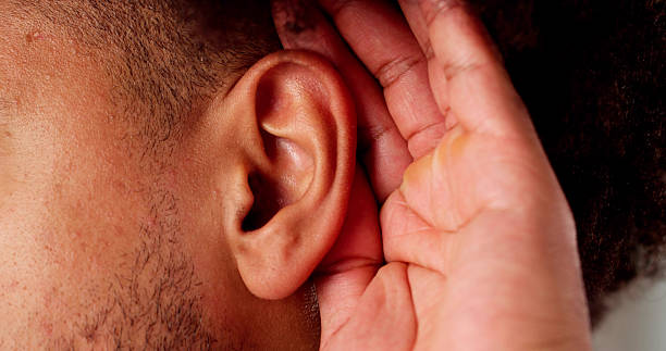 istock Audiologist treating African man with painful 2204992640
