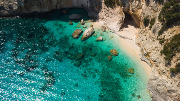istock Turquoise rocky cove from bird view. Summer and vacation background. 2204993090