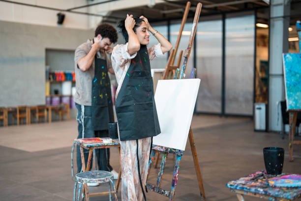 istock Diverse Art Class Participants Preparing to Paint in Bright and Spacious Studio 2204993723