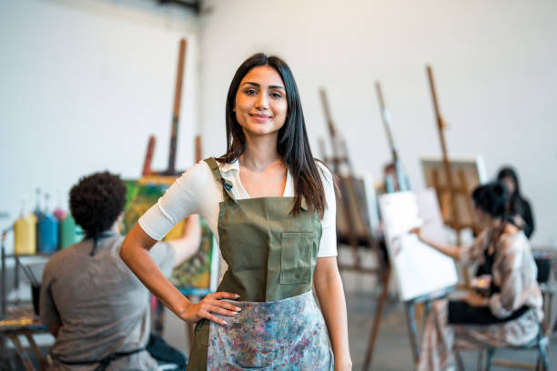 istock Confident Young Middle Eastern Female Art Teacher in a Creative Studio Setting 2204993798