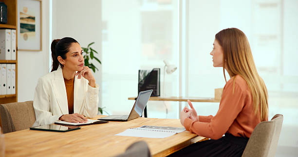 istock Talking, meeting and planning with woman with client in office for interior design brief, consulting or feedback. Property layout, creative project and timeline with people for real estate renovation 2204994655