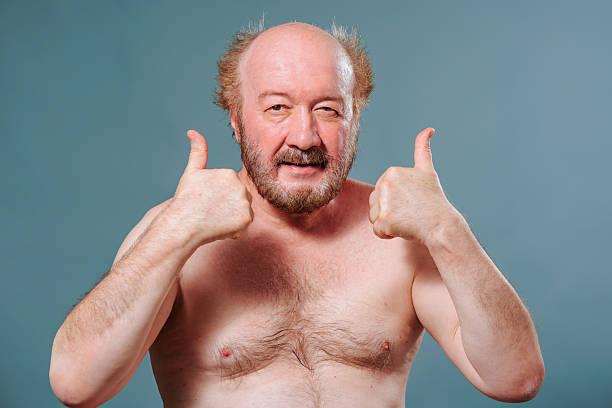 istock Man enthusiastically giving thumbs up against a plain background 2204995080