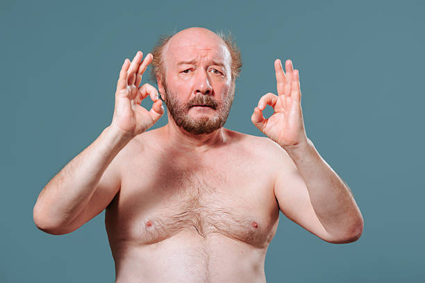 istock Expression of tranquility shown by a middle-aged man in relaxed pose 2204995092