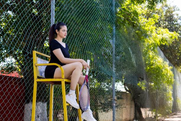 istock Young girl watching live game entertainment 2204996439