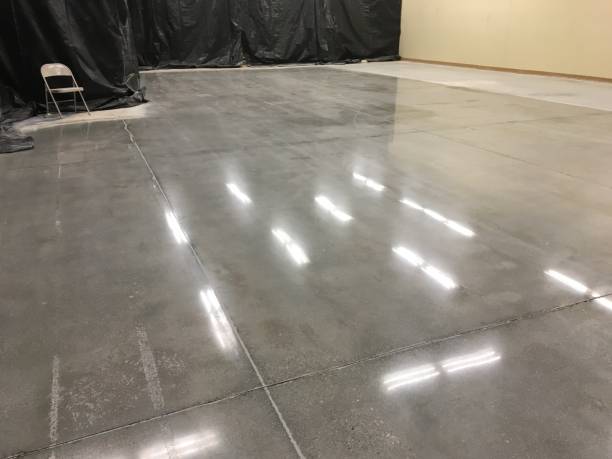 istock Shiny Fluorescent Light Reflections on Newly Polished Concrete Floor 2204999597