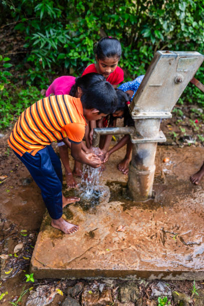 istock Sri Lankan children drinking a water, Ceylon 2205002540