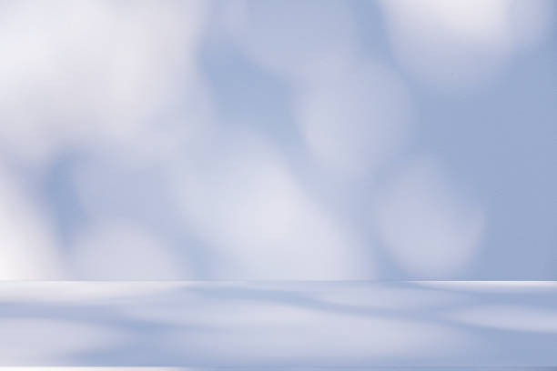 istock Studio style background wall decoration presentation uses white and blue tones. with shadows cast from a nearby window, concept creating a decorative 2205010302