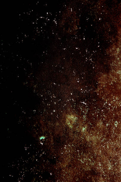 istock dark background of brown splashes on black 2205012370