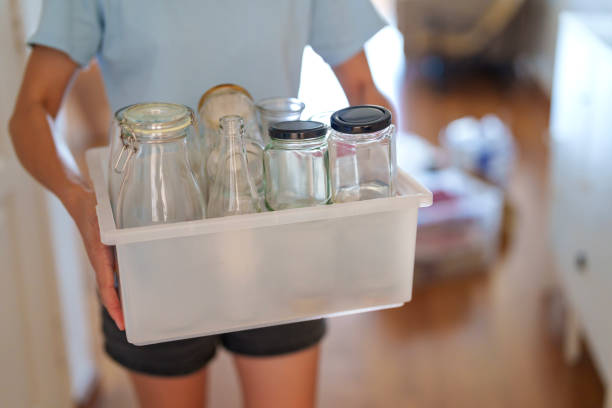 istock Sorting Recyclable Glass Jars for Waste Management 2205015186
