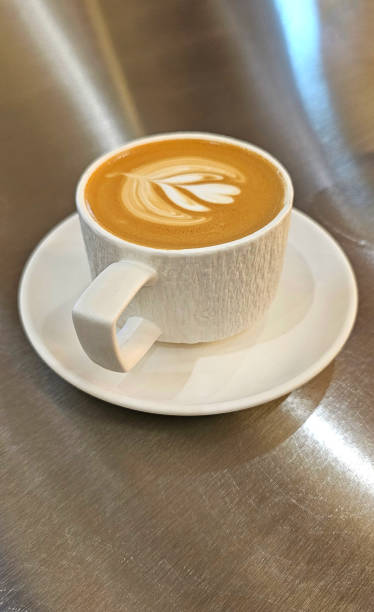 istock High angle view of latte on table in cafe. 2205015219
