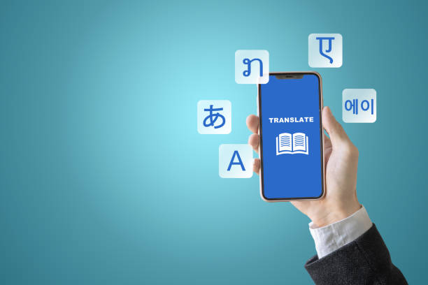 istock A person holds a phone with a blue screen with a translation text. The screen has multilingual book icons. 2205016898
