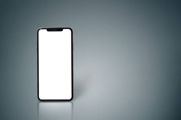 istock A white phone is sitting on a grey surface. The screen is black and the phone is turned off 2205017041