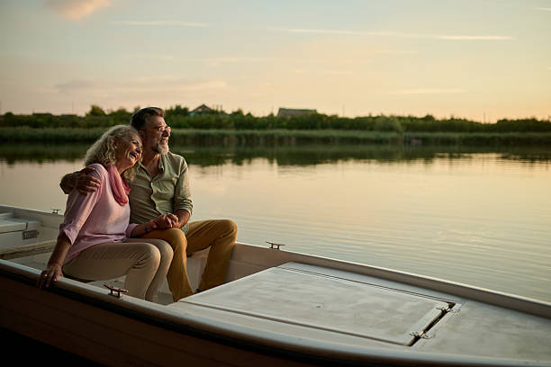istock Senior couple enjoying a romantic boat trip at sunset 2205019968