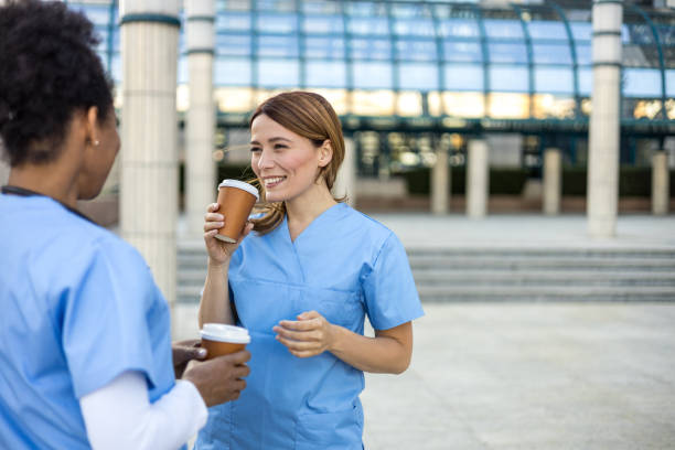 istock Two nurses enjoying a coffee break outside the hospital 2205026730