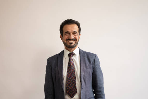 istock Mature Middle Eastern Businessman Smiling in Professional Attire 2205028191