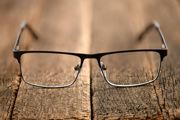 Reading glasses and black hard case isolated on white background. High resolution photo.