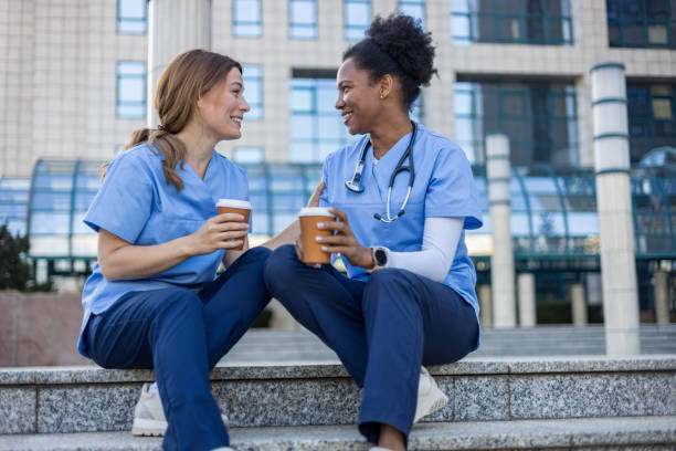 istock Two nurses enjoying a coffee break outside the hospital 2205029938