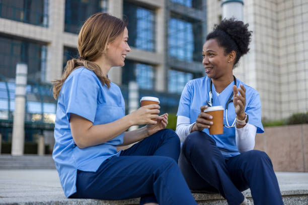 istock Two nurses enjoying a coffee break outside the hospital 2205029940