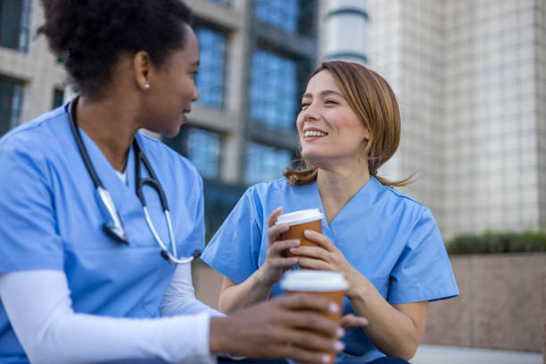 istock Two nurses enjoying a coffee break outside the hospital 2205030018