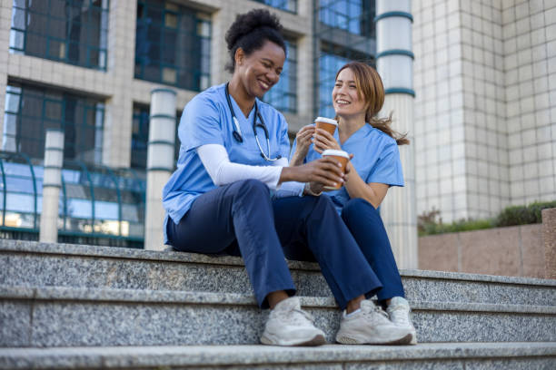 istock Two nurses enjoying coffee break outside hospital 2205030033