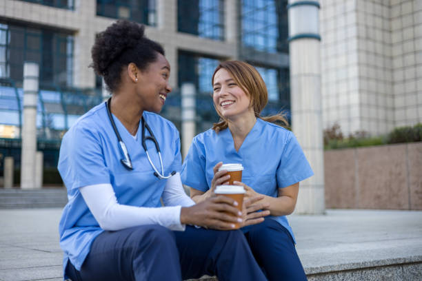 istock Two nurses enjoying a coffee break outside the hospital 2205030091