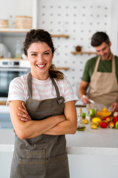 istock Professional success personal chef cook in customer private kitchen giving cooking lesson to people 2205033921