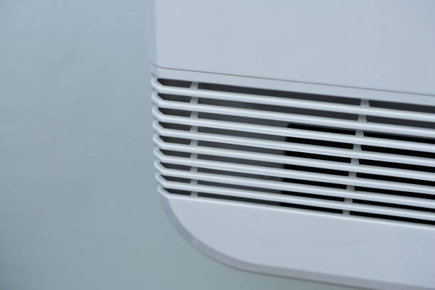 istock Air conditioner on a white wall. Close-up view. 2205034674