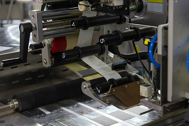 istock Printing machine in operation at manufacturing facility in the afternoon 2205034774