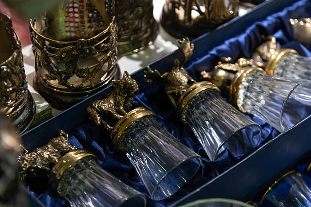 istock Vintage glassware collection displayed on a dark blue cloth 2205034961