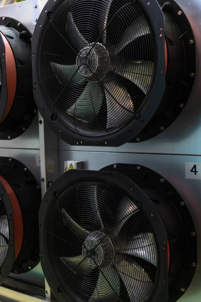 istock Large industrial fans providing ventilation in a mechanical facility 2205035150