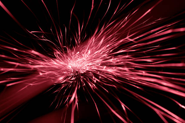 red sparks from the grinder glowing in the dark straight ahead
