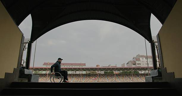 A Contemplative and Reflective Moment in a Stadium Triumphing Over Lifes Challenges