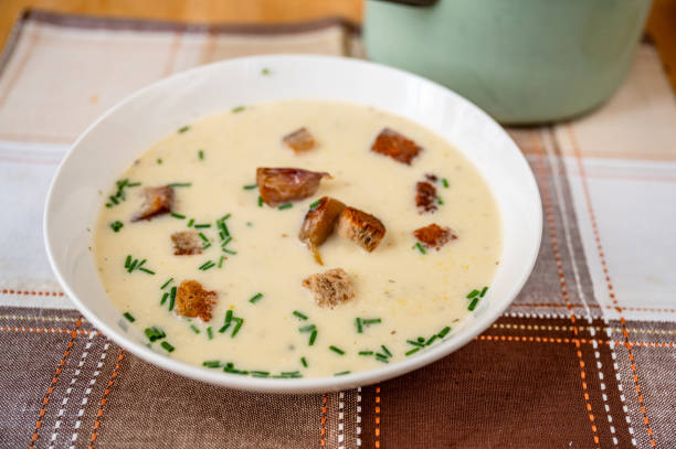 istock Roasted garlic soup with chive in plate. 2205037685