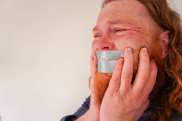 istock Emotional Struggle with Duct Tape 2205037930
