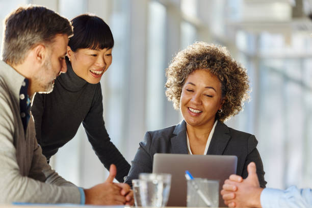istock Happy entrepreneurs working on laptop in the office. 2205038050