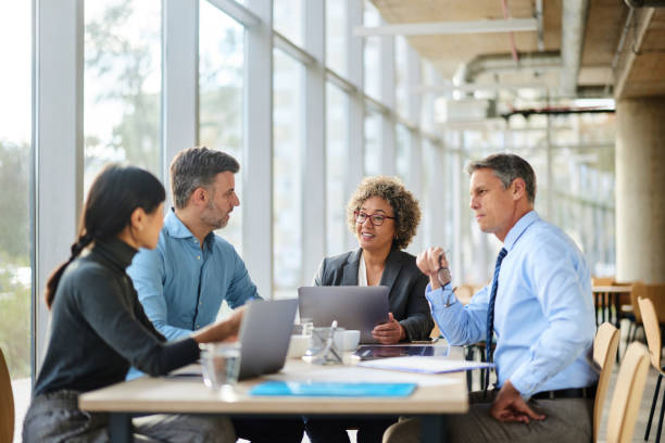 istock Happy multiracial business team talking on a meeting in the office. 2205038310