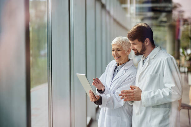 istock Medical experts working on touchpad in a hospital. 2205039400