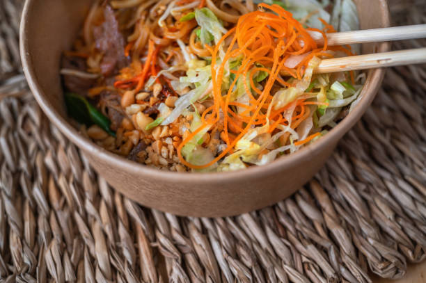 Asian meal, Pad thai in bowl, chopstick.