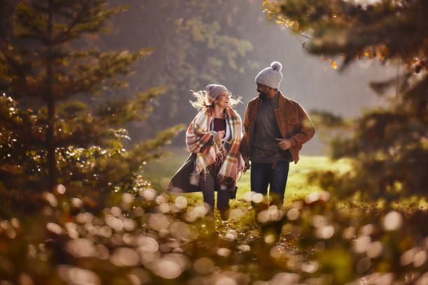 istock Carefree couple having fun while running in autumn day. 2205041048