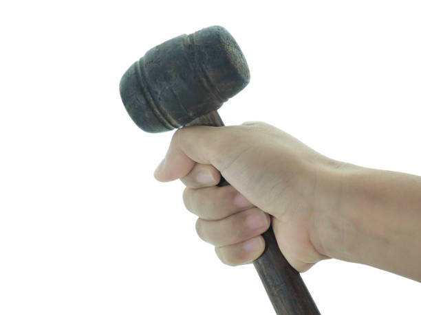 istock Female hand holding Rubber hammer isolated on white background with clipping path. 2205042069
