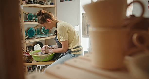 istock An Artisan Potter Passionately Creating Unique and Exquisite Clay Pottery at Their Workshop 2205042741