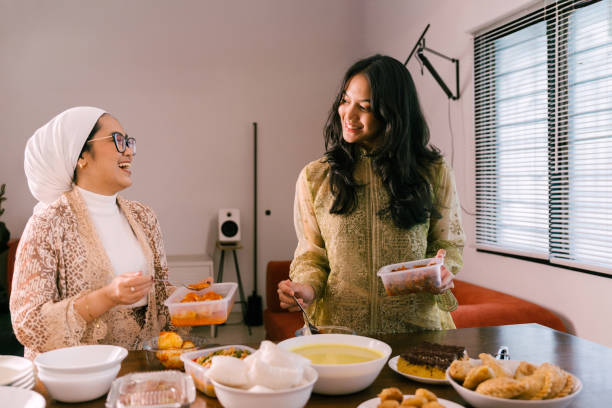 istock Young Beautiful Woman Preparing Food For Eid Mubarak 2205044211