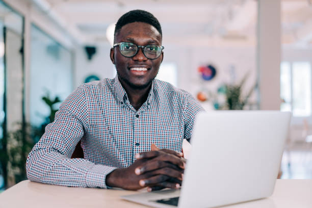 istock Successful businessman in modern office working on laptop. 2205045594