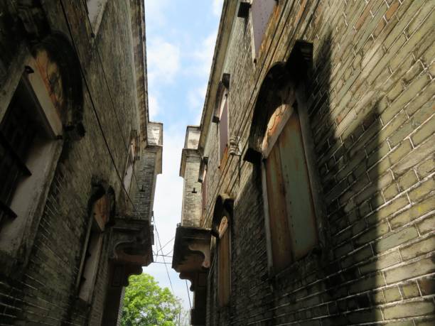 istock Narrow alley between historic brick buildings. 2205047270
