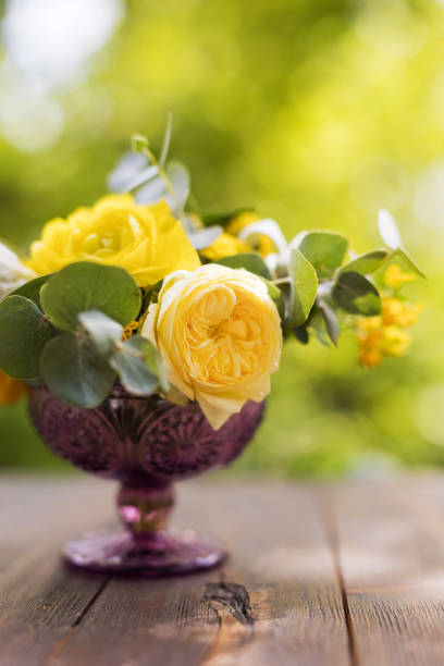 Yellow bouquet with roses,ranunculus,chrysanthemums and eucalyptus
