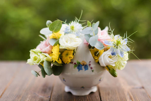 Bowl with flowers floating on water in asian wellness spa