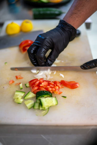 istock Chef preparing fresh vegetables for indian dish in restaurant kitchen 2205048374