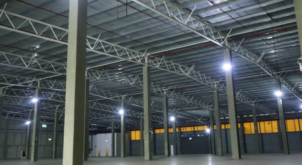 istock an empty industrial warehouse with large, clean windows, atmospheric light, white. 2205049038
