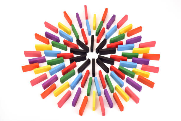 istock Multicolored wooden dominos forming a circle 2205049128